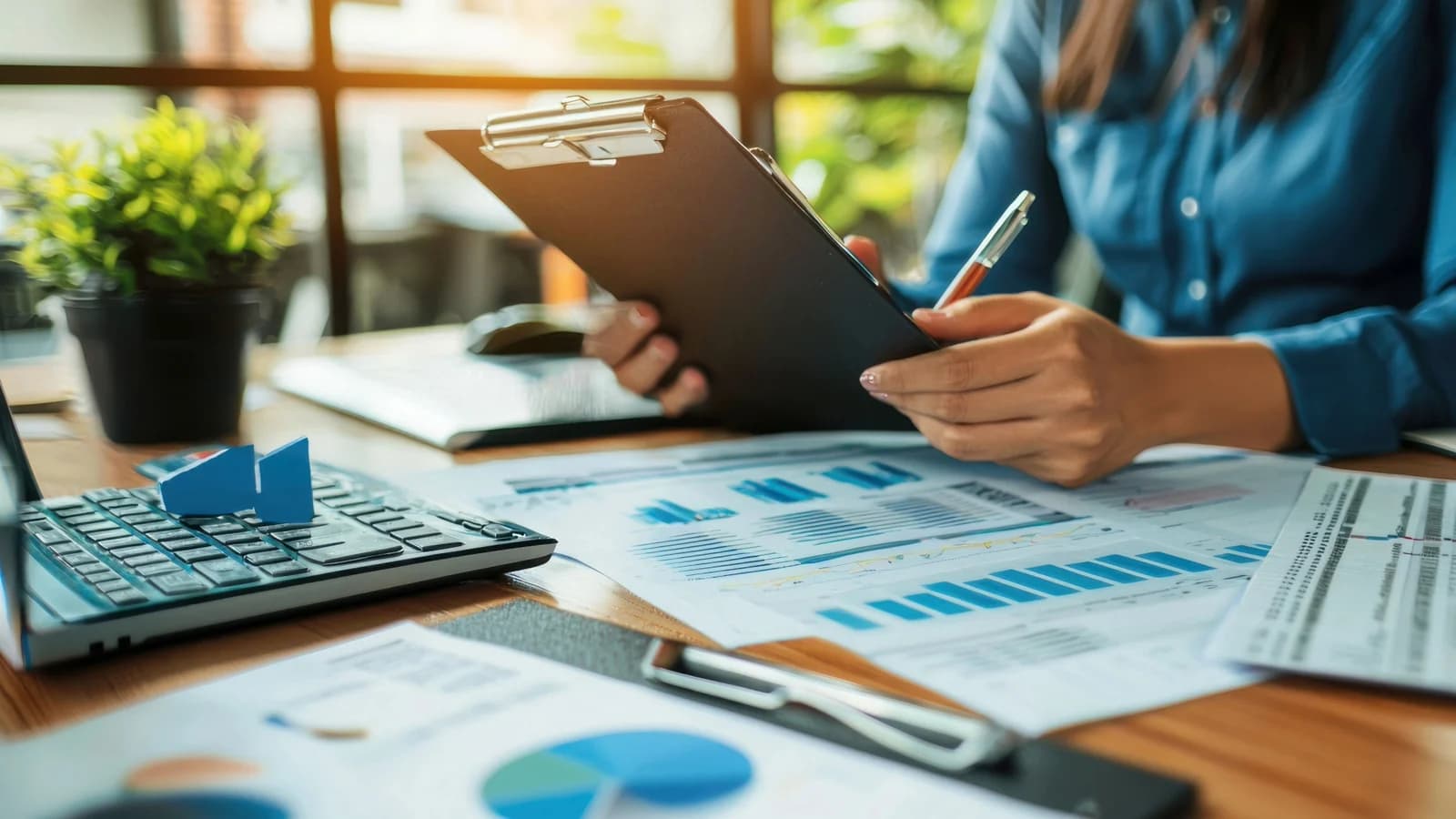 Business owner reviewing financial reporting and compliance information